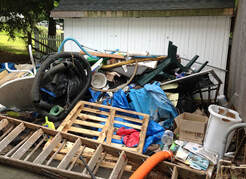 Picture of a pile of junk outside a home in WNY
