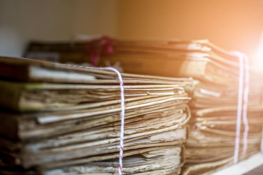 picture of piled junk documents that needs to be cleaned